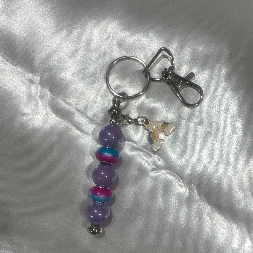 Addie’s Bag Charms purple and rainbow with rainbow charm